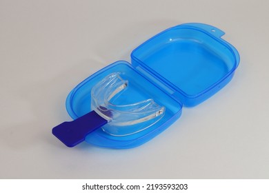 A Mouth Guard, Anti Snoring, With Its Blue Handle