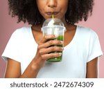 Mouth, health and woman drinking green juice for detox, nutrition or wellness vegan diet. Breakfast, weight loss and female person enjoying organic smoothie for vitamins isolated by studio background