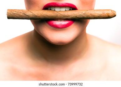 mouth with red lips with a cigar between the teeth