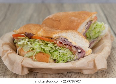 Mouth Watering Roast Beef Sandwich Loaded With Melted Pepper Jack Cheese And Wrapped In A Freshly Baked Italian Roll For A Hearty Meal.