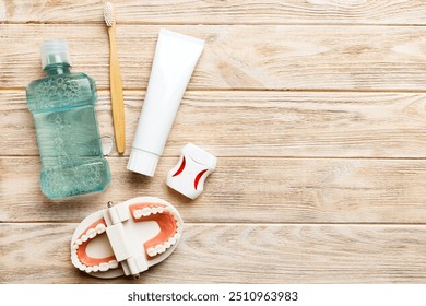 Mouthwash and other oral hygiene products on colored table top view with copy space. Flat lay. Dental hygiene. Oral care kit. Dentist concept. - Powered by Shutterstock