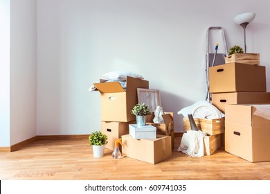 Move. Cardboard boxes and cleaning things for moving into a new home - Shutterstock ID 609741035