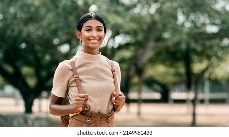 Move In Silence, Never Let Them Know Your Next Move. Portrait Shot Of An Attractive Young Female Student Outside On Campus.