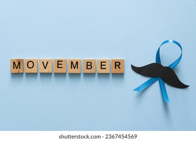 Movember concept - event to raise awareness of men's health issues, moustache anf blue ribbon - Powered by Shutterstock