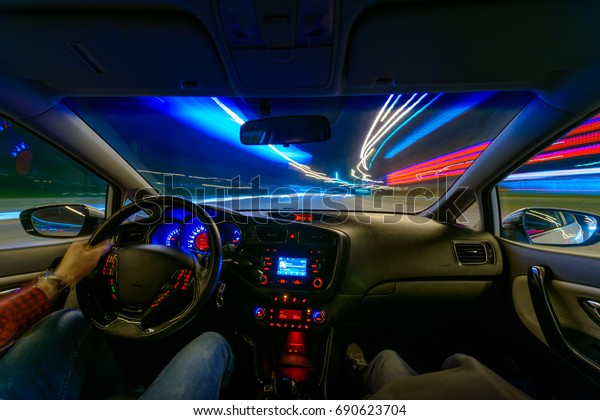 Movement of the
car at night at a speed view from the interior, Brilliant road with
lights with a car at high
speed