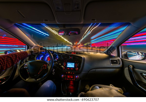 Movement of the
car at night at a speed view from the interior, Brilliant road with
lights with a car at high
speed