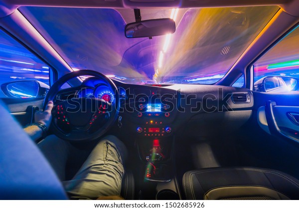 The movement of the car at speed.Blurred\
background view of the car\
dashboard.