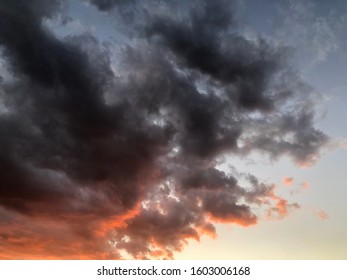 Movement of dark cloudy floating over sunset sky.Atmosphere view of dramatic sky. Colorful dawn sky background.