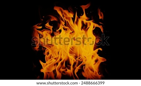 Movement of realistic fire flames, creating hellish heat and dynamic blaze on black.