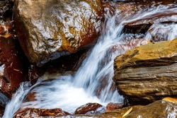 Movement Of River Water Flowing Between Rocks In The Rainforest In Minas Gerais, Brazil