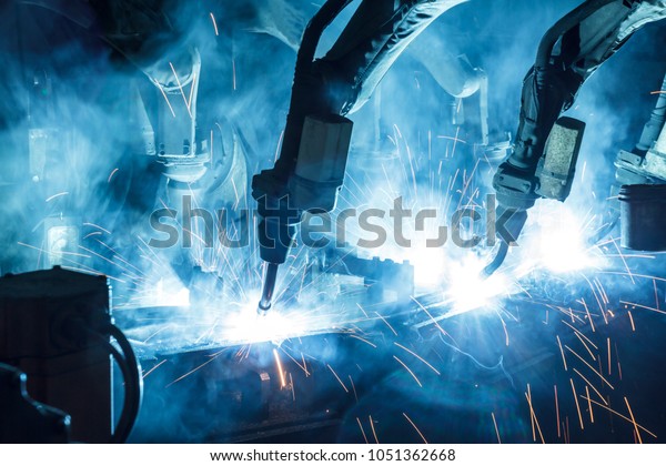The movement of the robot welding in an auto\
parts factory.