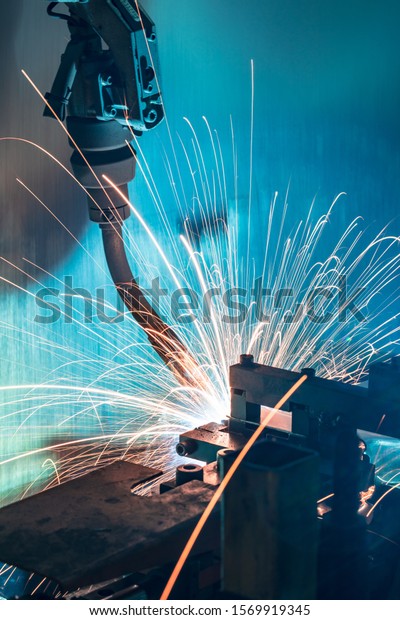 The movement of the robot welding in an auto\
parts factory.