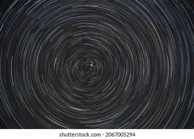 Movement Of Stars Around Pole Star On North Hemisphere. Startrails On Night Sky, Long Exposure Composition.