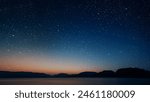 movement of stars in the night sky with the view of mountains	