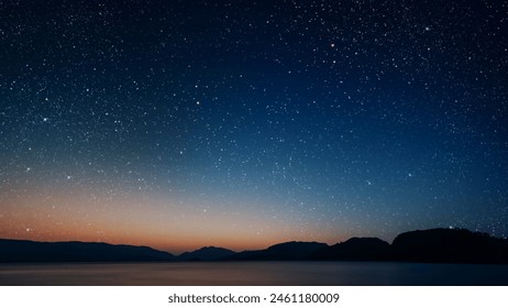 movement of stars in the night sky with the view of mountains	