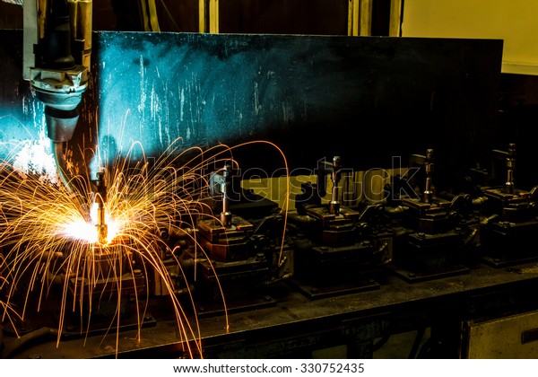 The\
movement of the welding robot in a car\
factory