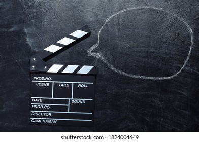 Movie Clapper Board With Dialogue Cloud On Chalk Blackboard. Cinema Industry, Entertainment