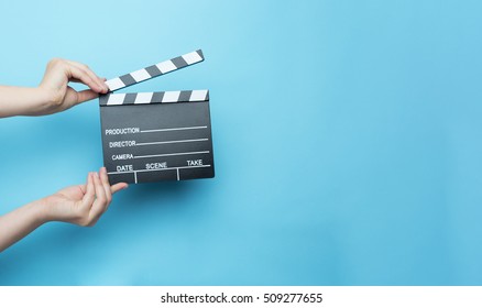 movie clapper on blue background, cinema concept