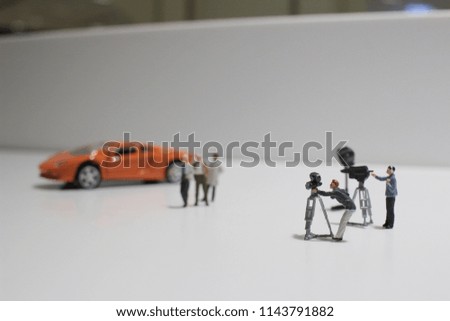 the movie making of small figure at the white background