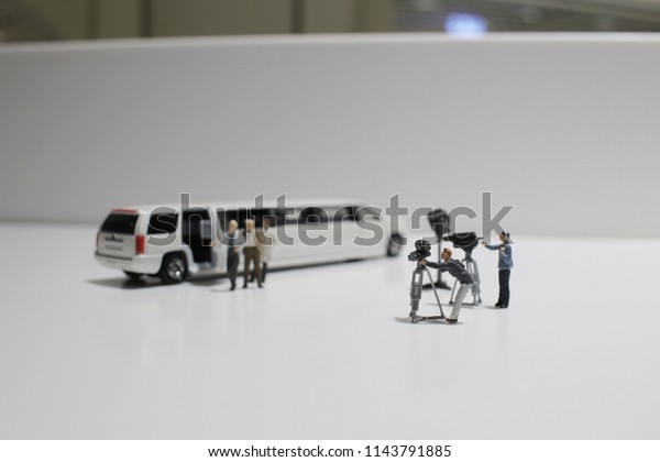 the\
movie making of small figure at the white\
background