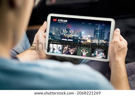 Movie and series stream VOD service in tablet. Watching on demand tv show or film online. Man choosing video entertainment from subscription media catalogue. Streaming website library mockup.