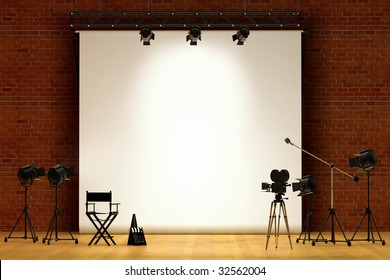 Movie Set Inside A Sound Stage With Movie Lights, Movie Camera, Boom Mic, Director's Chair, Megaphone And Clapper Board