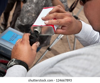 Movie Special Effects Worker Filling Explosive Powder Outdoors