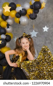 Movie Super Star Girl Model Posing In Studio Shoot With Golden Star And Colorful Baloons Wearing Stylish Gold Airy Dress With Shining Bow Tie.Super Star Pillow Deisigned By Photographer