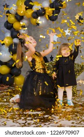 Movie Super Star Girl Model Posing In Studio Shoot With Golden Star And Colorful Baloons Wearing Stylish Gold Airy Dress With Shining Bow Tie.Super Star Pillow Deisigned By Photographer