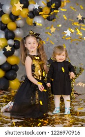 Movie Super Star Girl Model Posing In Studio Shoot With Golden Star And Colorful Baloons Wearing Stylish Gold Airy Dress With Shining Bow Tie.Super Star Pillow Deisigned By Photographer