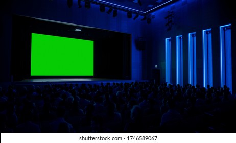 In Movie Theater Captivated Audience Watching New Blockbuster Film On Mock-up Green Screen. People Watching Video Game Tournament Streaming, Concert Video, Product Release Trailer.