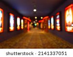 Movie theater entrance interior blur image use for background of business and cinema concept. Abstract blurred image of lobby of movie theater in Vietnam.