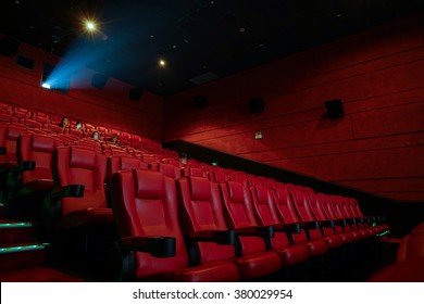 Movie Theater With Red Seats In Luxury Hotel.
