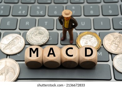 Moving Average Convergence Divergence (MACD) Is A Trend-following Momentum Indicator Moving Averages Of A Security’s Price. Word Is Written On Dice, Near Money，keyboard.