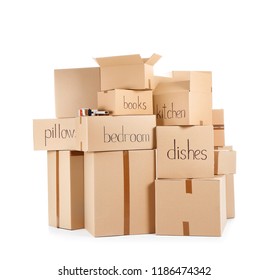 Moving boxes and adhesive tape dispenser on white background - Shutterstock ID 1186474342