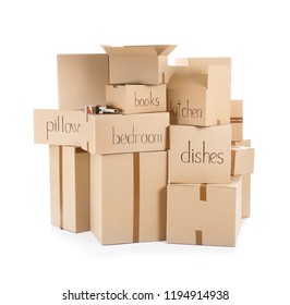 Moving boxes and adhesive tape dispenser on white background - Shutterstock ID 1194914938