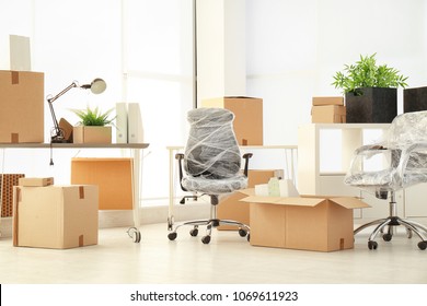 Moving Boxes And Furniture In New Office