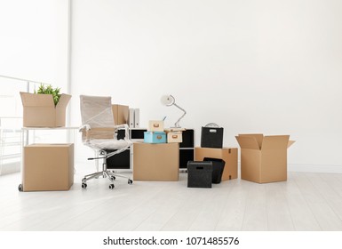 Moving Boxes And Furniture In New Office