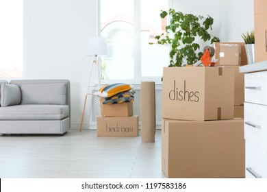 Moving boxes and household stuff indoors. Space for text - Shutterstock ID 1197583186