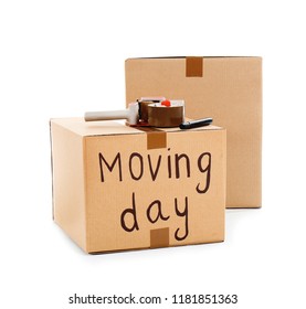 Moving boxes, marker and adhesive tape dispenser on white background - Shutterstock ID 1181851363