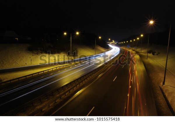 Moving car\'s light trails when\
moving on highway. Shot taken in Kaunas, Lithuania,\
2018/01/28