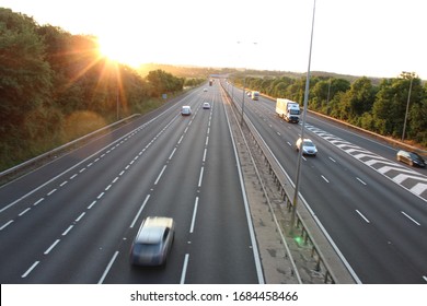 Moving cars on the motorway during sunset