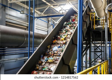 moving conveyor transporter on Modern waste recycling processing plant. Separate and sorting garbage collection. Recycling and storage of waste for further disposal. 