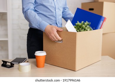 Moving Day Concept - Close Up Of Man Holding Box With His Things In The Office