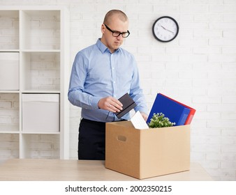 Moving Day - Fired Sad Man Packing Or Unpacking His Things In Empty Office