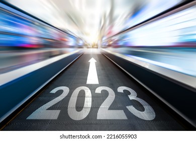 Moving Escalator Walkway With New Year Number 2023 And Arrow Sign In The Airport