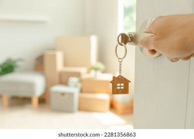 Moving house, relocation. Man hold key house keychain in new apartment. move in new home. Buy or rent real estate. flat tenancy, leasehold property, new landlord, investment, dwelling, loan, mortgage. - Shutterstock ID 2281356863