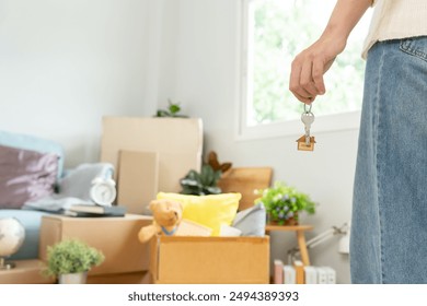 Moving house, relocation. Woman hold key house keychain in new apartment. move in new home. Buy or rent real estate. flat tenancy, leasehold property, new landlord, dwelling, loan, mortgage.
 - Powered by Shutterstock