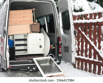 Moving House In Winter, A Minivan Full Of Used Furniture And Household Stuff