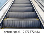 moving up in modern escalator in train station